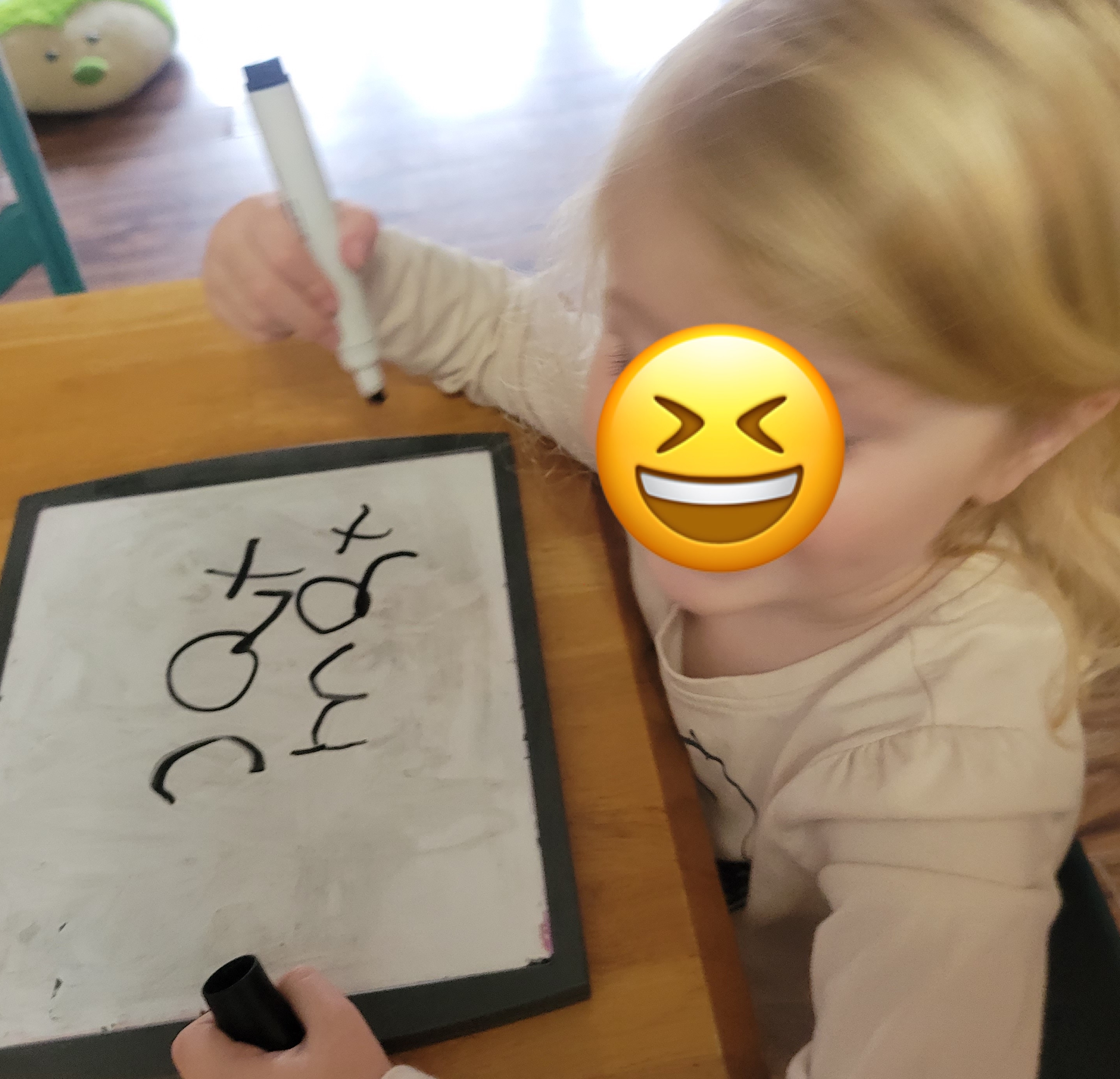 writing letters on marker board